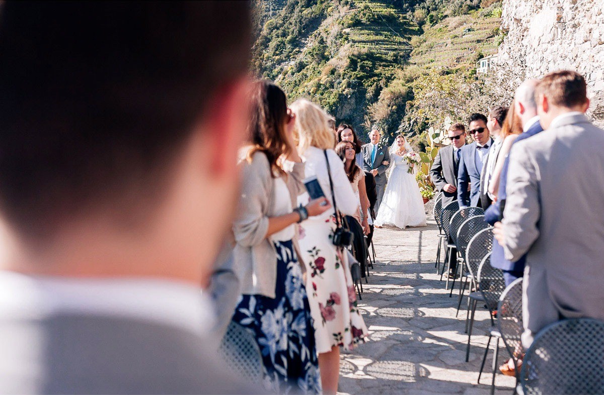 The bride walking down the aisle in Vernazza